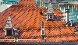 A Ladder Set Up Against a Tiled Residential Roof for Ongoing Repair Work in Northfield, OH