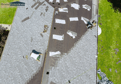 Workers Install New Shingles During a Roof Replacement for a Residential Home in Northfield, OH