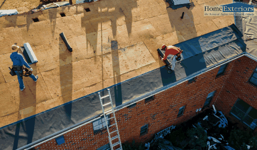 A Team Of Workers Repairs A Residential Roof With Tools And Safety Gear In Parma, OH