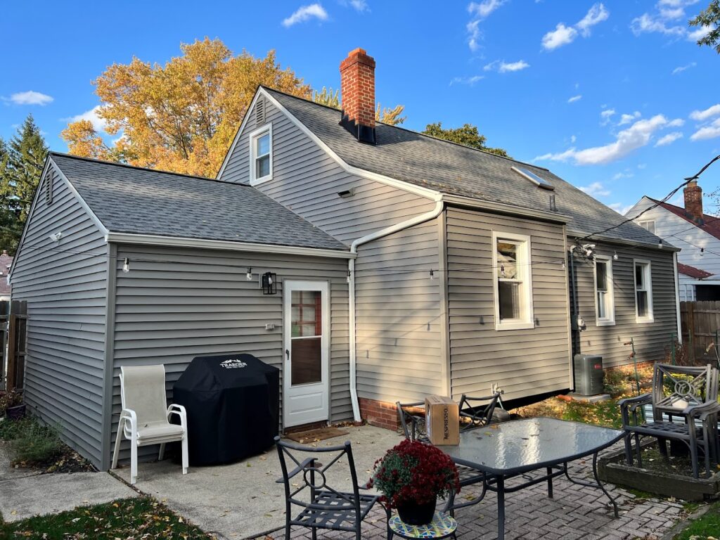 Gray siding replacement and new roofing on a home in the Northfield, OH area